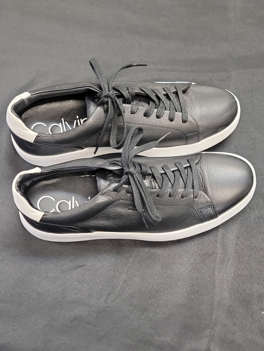 Calvin Klein Men’s Black Leather Sneakers with White Heel Accent